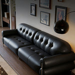 Load image into Gallery viewer, Modern Black Tufted Leather Sofa Minimalist Deep Seat Couch with Sculptural Armrests
