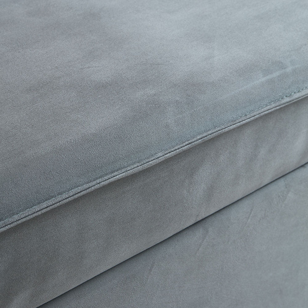 Close-up of soft gray fabric upholstery on the sleeper sofa bed
