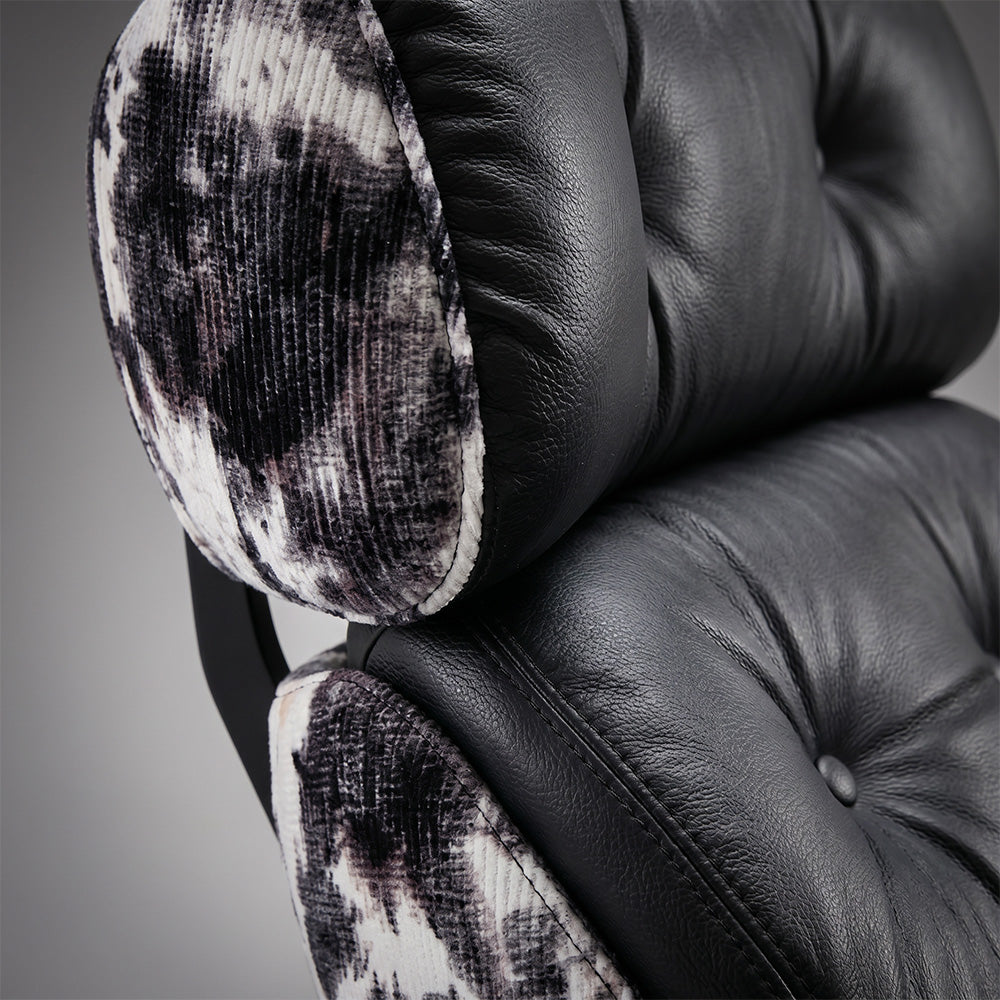 Rocking Lounge Chair with Black Cushions and Abstract Patterned Shell