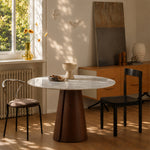 Load image into Gallery viewer, Modern Round Dining Table with Walnut Veneer Top &amp; Travertine-Inspired Pedestal Base
