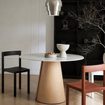 Load image into Gallery viewer, Modern Round Dining Table with Walnut Veneer Top &amp; Travertine-Inspired Pedestal Base
