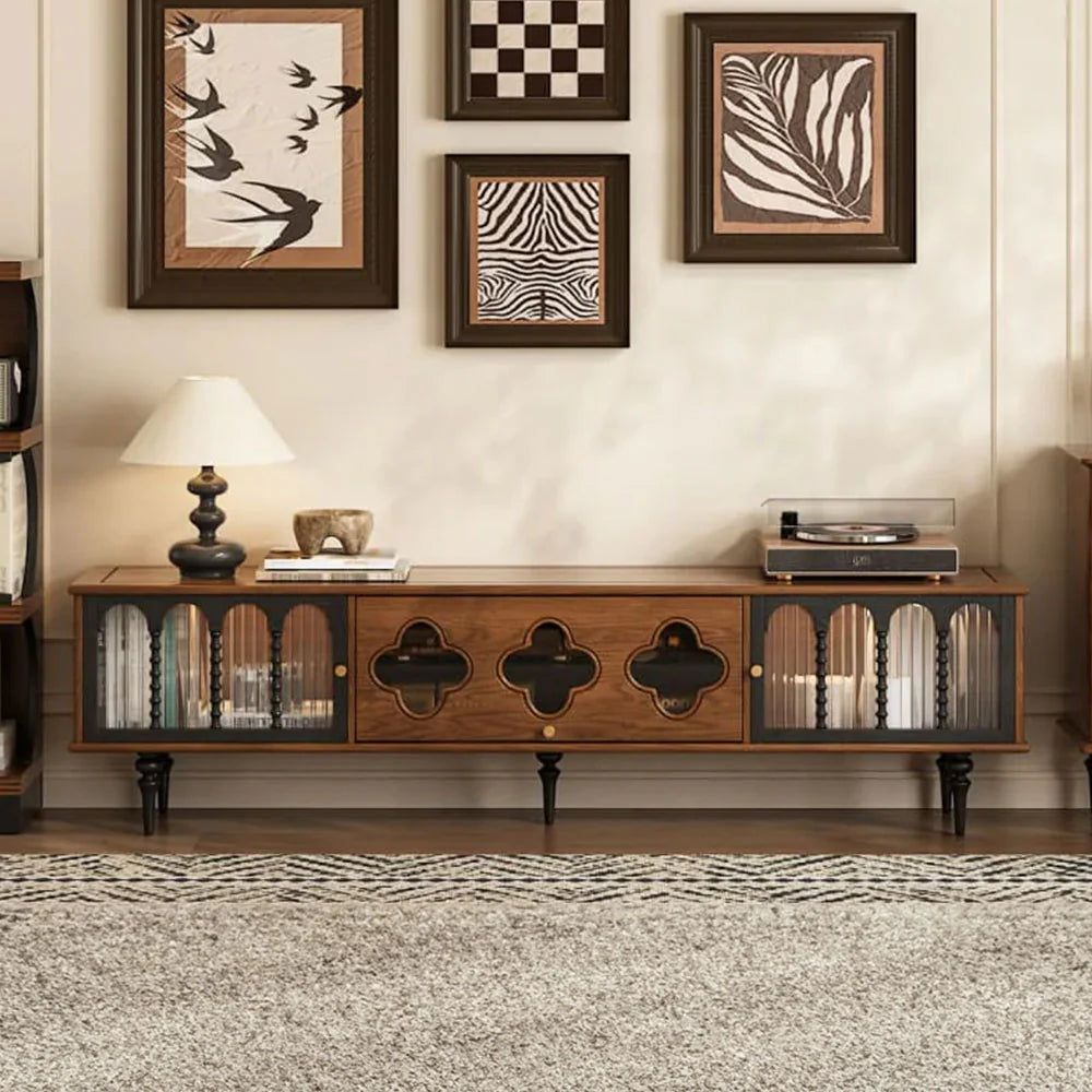 Wooden entertainment console with decorative items in a living room setting