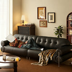 Load image into Gallery viewer, Modern Black Tufted Leather Sofa Minimalist Deep Seat Couch with Sculptural Armrests
