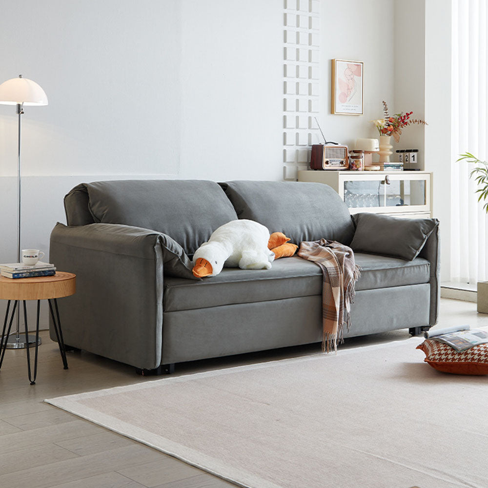 Side view of pull-out sofa bed with gray fabric and clean lines