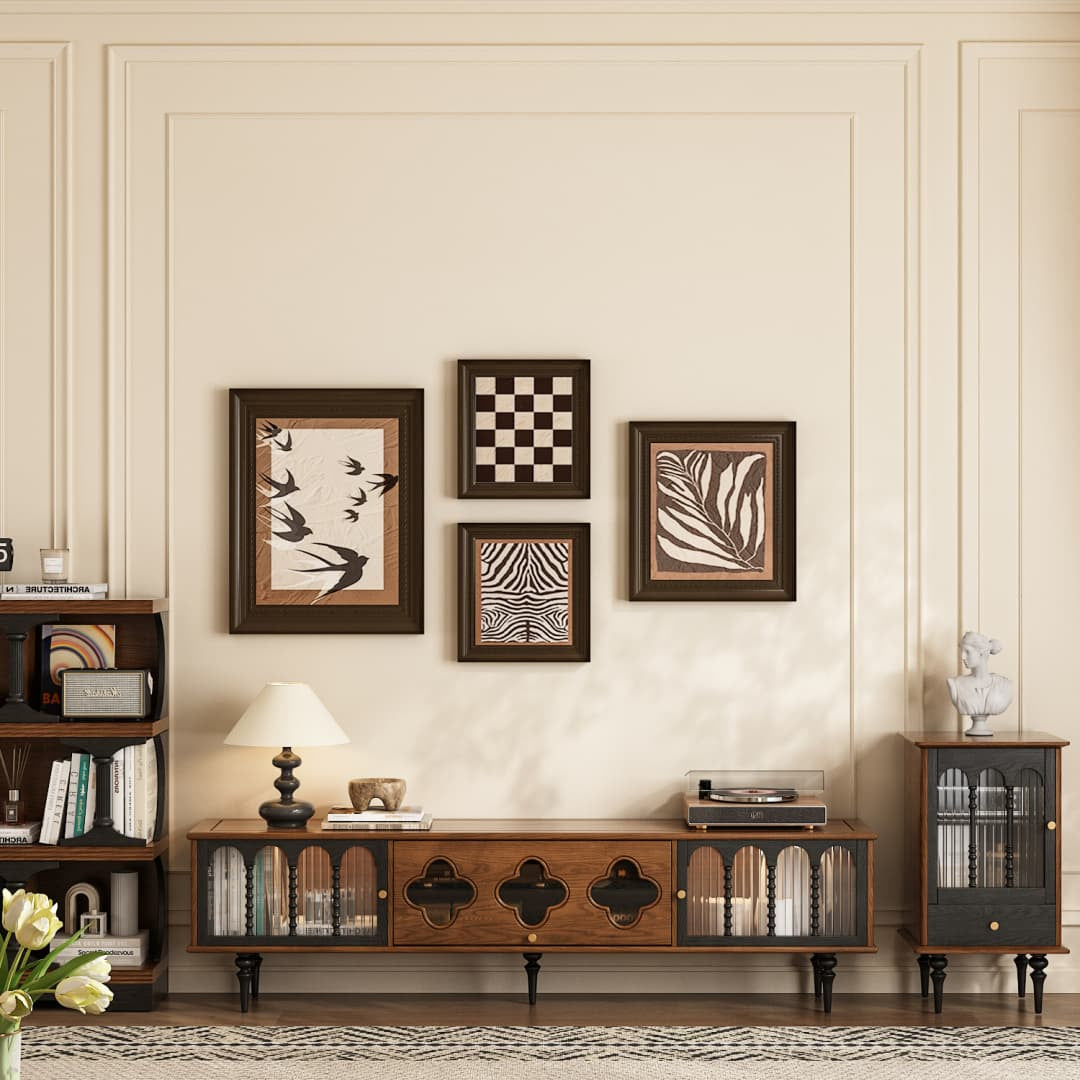 Living room with wooden furniture, decorative wall art, and a lamp.