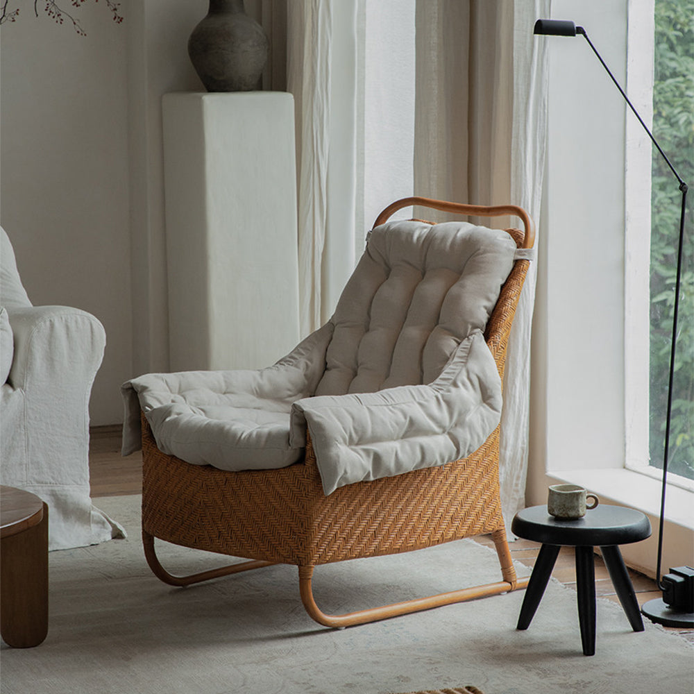 Boho Rattan Lounge Chair with Tufted Cushion and Relaxed Seating