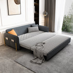 Load image into Gallery viewer, Gray velvet sleeper sofa with a blanket and pillows in a modern living room.
