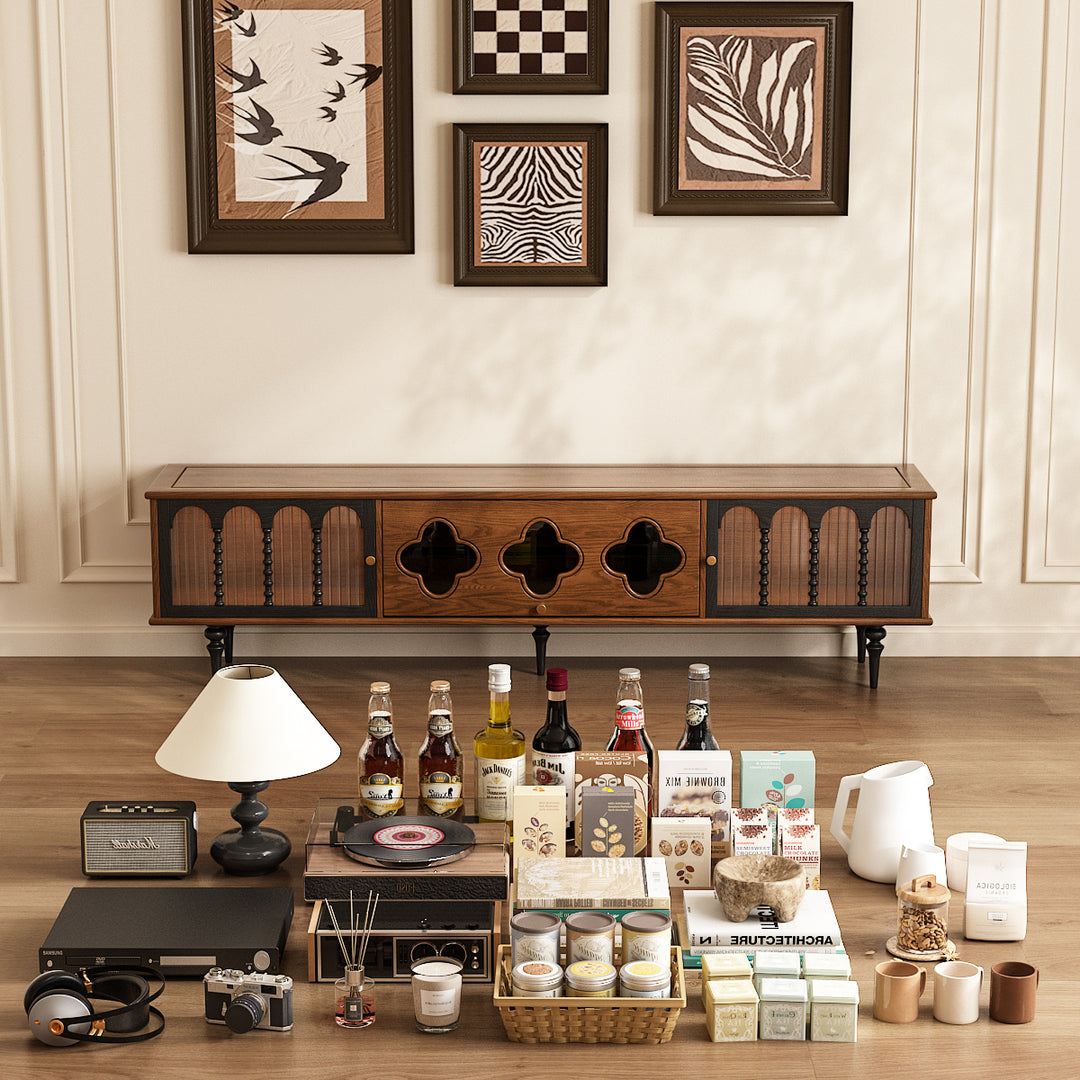 Wooden tv stand with decorative items on a wooden floor