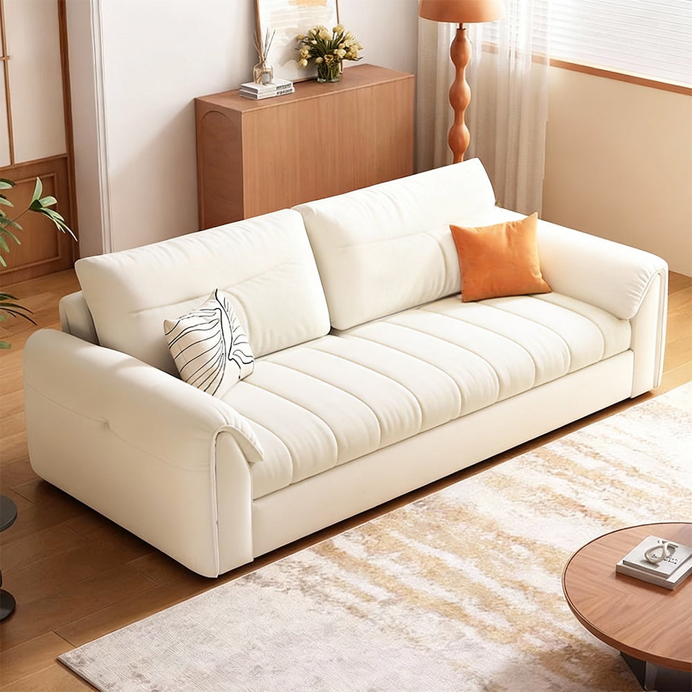 Convertible sofa bed styled in a modern living room with storage drawer and cozy seating