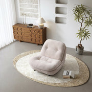 Modern Low Lounge Chair with Plush Cushioning and Rounded Silhouette